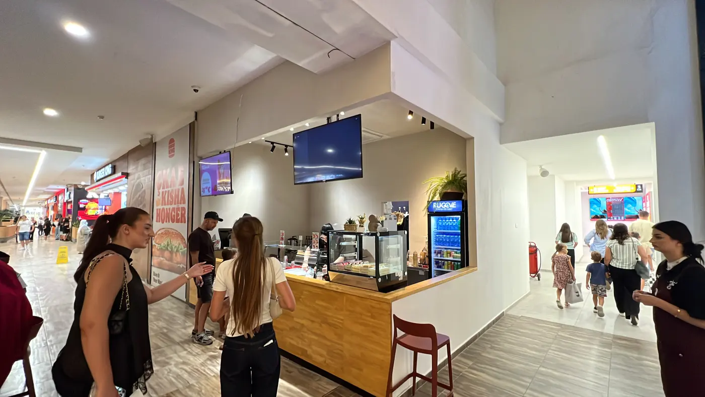 Tai Sweets counter inside Albi Mall with the cake display and drinks fridge